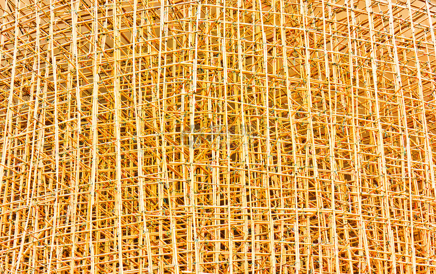 建筑工地的竹子脚架工作金属建筑学职业天空构造基础设施脚手架海拔建造图片
