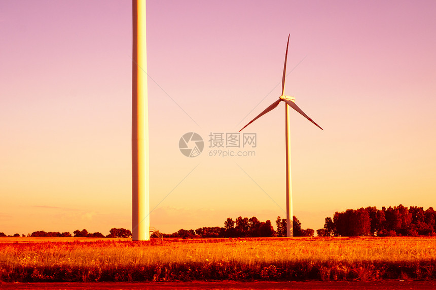 黄昏时的风涡轮摄影产业力量水平环境绿色风力日落日出风车图片