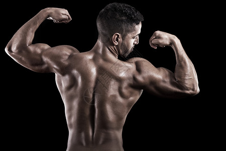 黑人背景的肌肉男弯曲姿势力量阴影黑色锻炼男性躯干艺术运动员背景图片