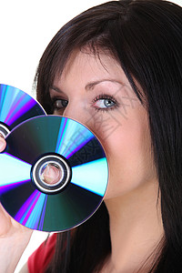CD格式妇女持有CD光盘女士音乐格式眼睛圆形头发鼻子隐藏贮存背景