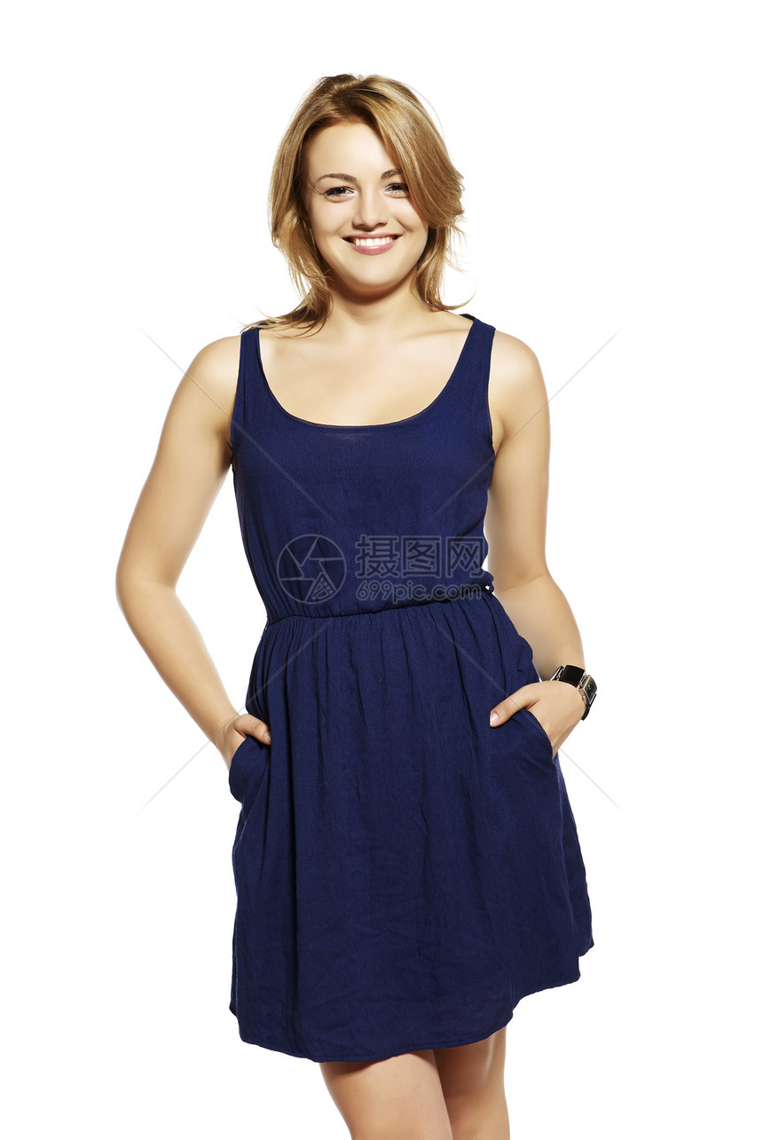 有吸引力的年轻女性金发女郎影棚衣服蓝色快乐女孩身材魅力微笑高跟鞋图片