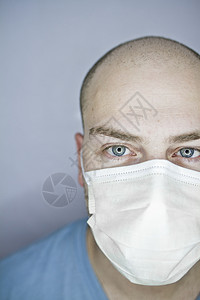 半脸白面罩口罩秃头蓝色人脸环形横截面医院外科男性成人背景图片