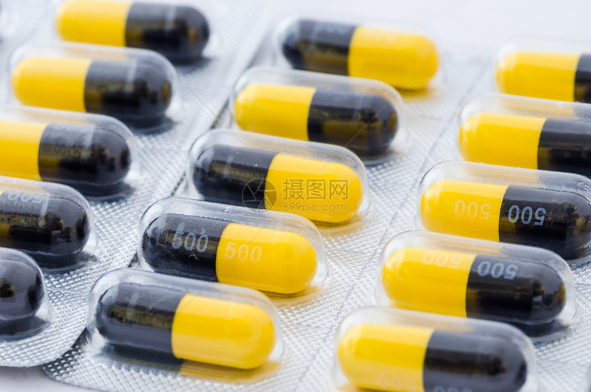 黑色和黄色胶囊团体剂量药店宏观制药疾病药品图片