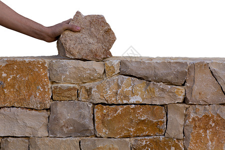 梅森手在石石墙上工作石头石匠建筑学工人建造栅栏岩石劳动者石墙材料地中海高清图片素材