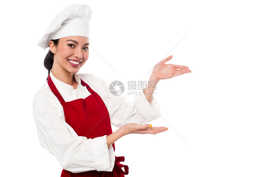 女厨师介绍一些东西烹饪面包师女性手掌厨房职业餐厅女孩商业微笑图片