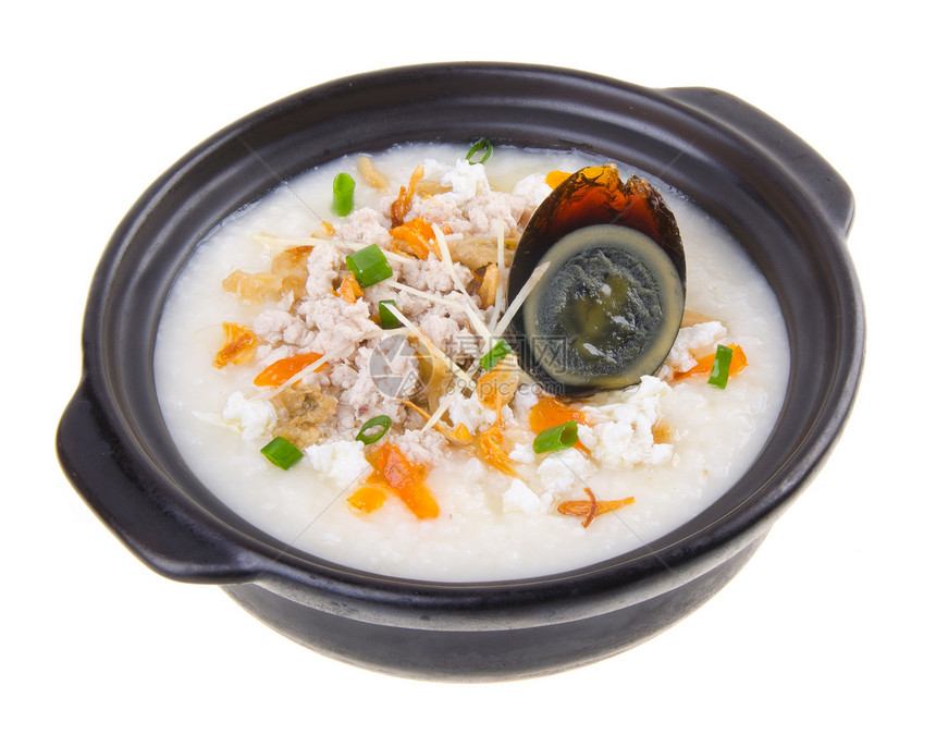 传统的中华世纪鸡蛋和猪肉粥炒饭稀饭饮食美食食物勺子盘子鸭蛋鸭子猪肉烹饪图片