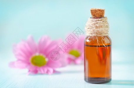 芳烃油香味情绪疗法花瓣花朵瓶子芳香沙龙温泉化妆品背景图片