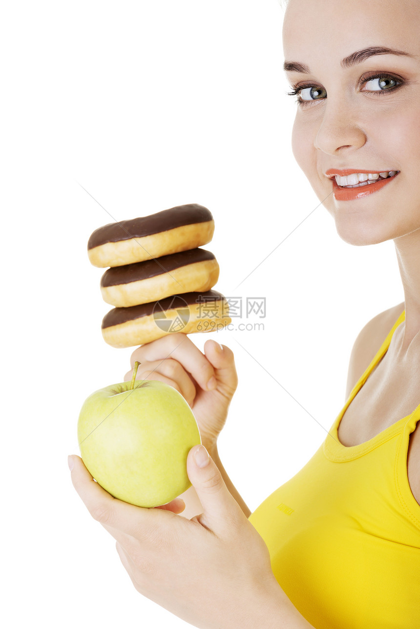 甜甜圈或绿苹果  硬选择蛋糕减肥思考营养甜点食物饮食垃圾损失女孩图片
