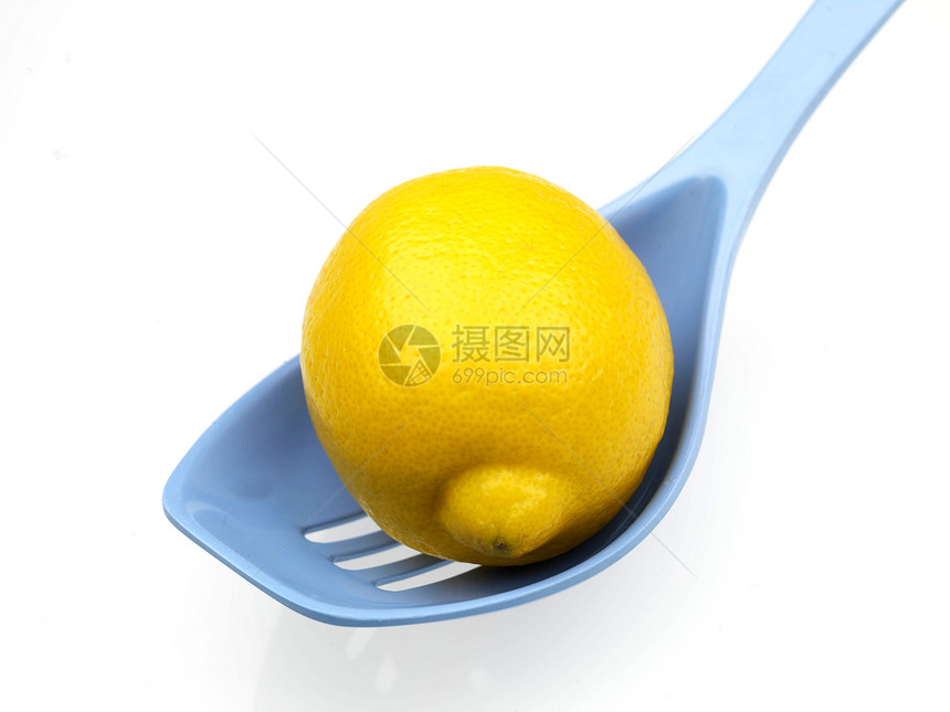 柠檬食物厨房白色水果用具蓝色塑料勺子图片