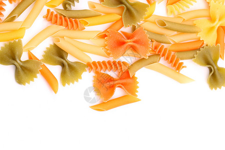 三种颜色的不同面条绿色三色派对饺子橙子食物螺旋黄色营养品背景图片