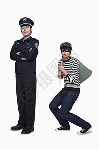 中国法制宣传日警察和小偷安全警官隐藏帽子法律影棚逮捕刑事制服摄影背景