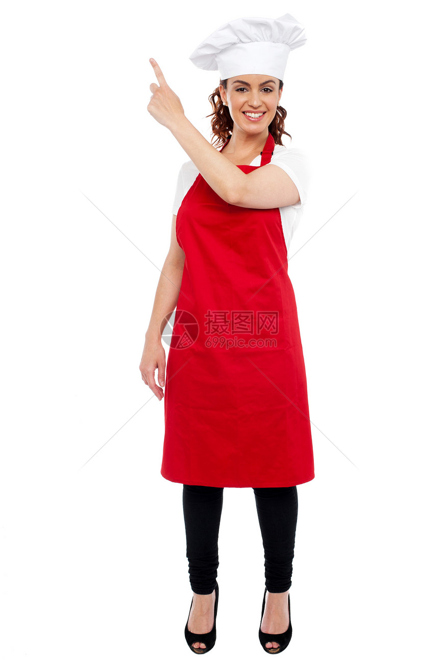 女性厨师指向远方的全长肖像工作面包师职业帽子食谱厨房服务面包商业食物图片