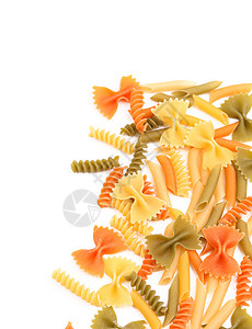三种颜色的不同意面框架绿色黄色饺子橙子食物螺旋营养品三色面条背景图片