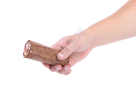 手拿着一卷巧克力冰淇淋静物棕色用具食物育肥味道甜点背景图片