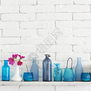 白色砖货架上的瓶子白色玻璃创造力糖果贮存罐子植物蓝色雏菊架子背景