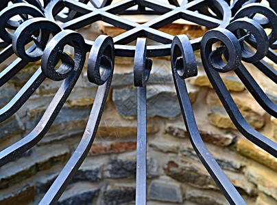 铁制铁金属建筑学花园艺术公园边界框架铁匠黑色栅栏格子背景图片