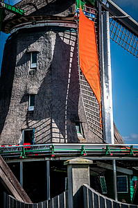 荷兰风车翅膀建筑天空蓝色瓷砖能源木头背景图片