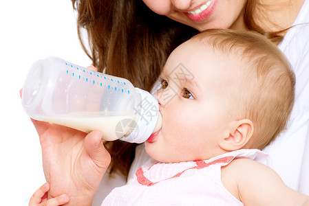 婴儿喂奶 婴儿用瓶子牛奶吃奶营养小瓶母亲家庭妈妈微笑几个月孩子公式新生背景图片