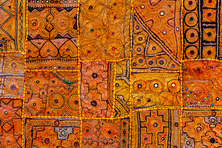 印度多彩印度服装纺织业装饰装饰品情调刺绣地毯异国手工业挂毯被子橙子背景图片