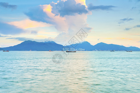 香港海岸的日落植物反射金子气候橙子太阳天空场景海洋热带背景图片