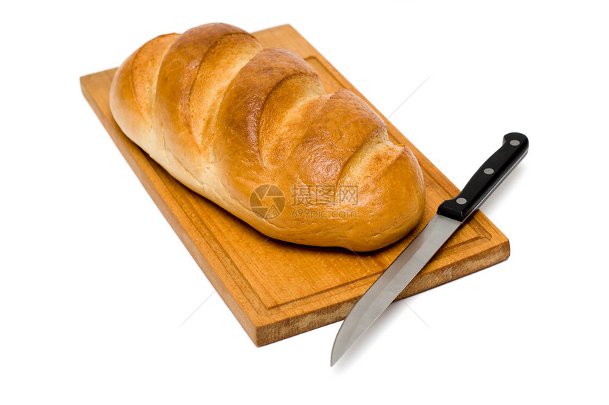 面包板上带刀子的新鲜自然面包糖类木板早餐大麦木头烹饪蛋糕面粉饮食产品图片