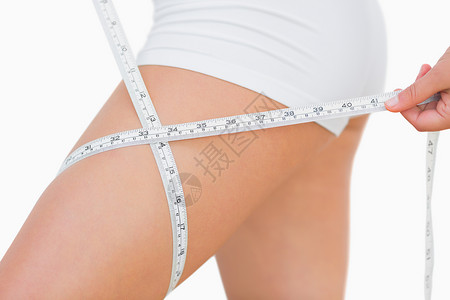 大腿尺寸女性的中流体周长节食躯干卷尺磁带饮食身体重量数字背景图片