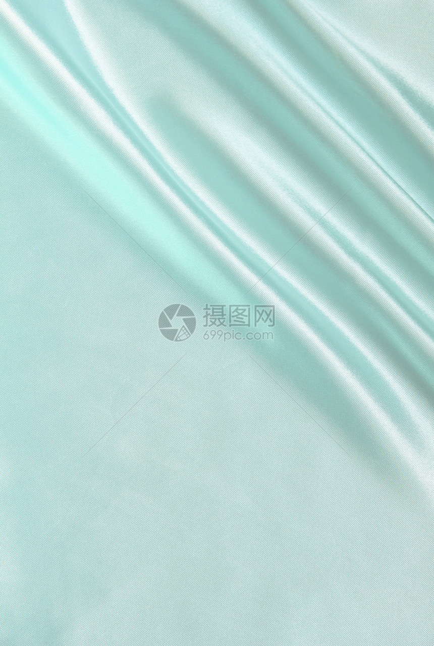 平滑优雅的蓝色丝绸作为背景材料曲线纺织品海浪投标折痕织物布料银色图片