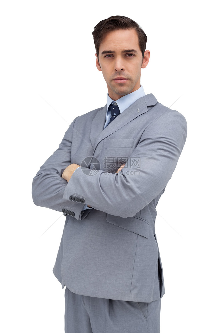 认真的商务人士在看镜头双臂商务人士自信男性套装男人领带魅力专注图片