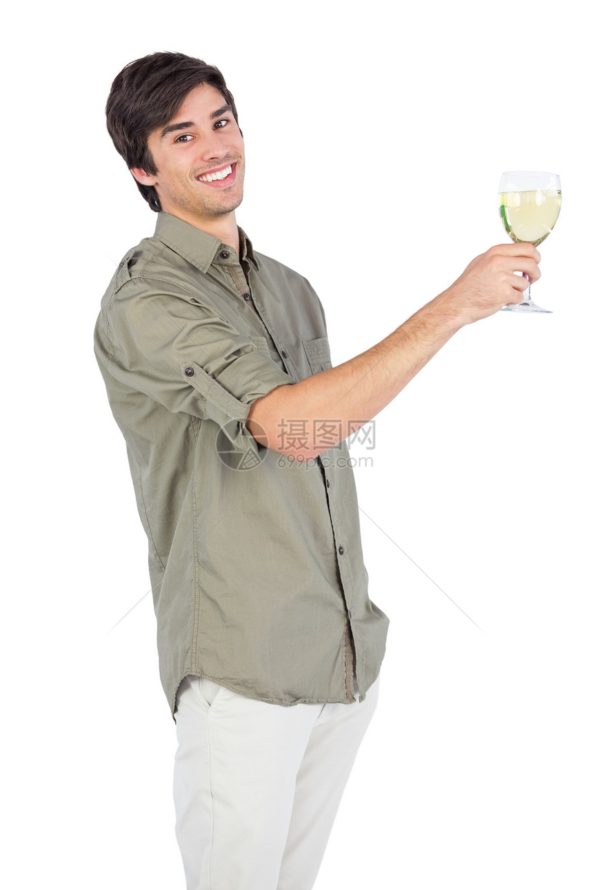 快乐的年轻人 用酒杯白葡萄酒图片