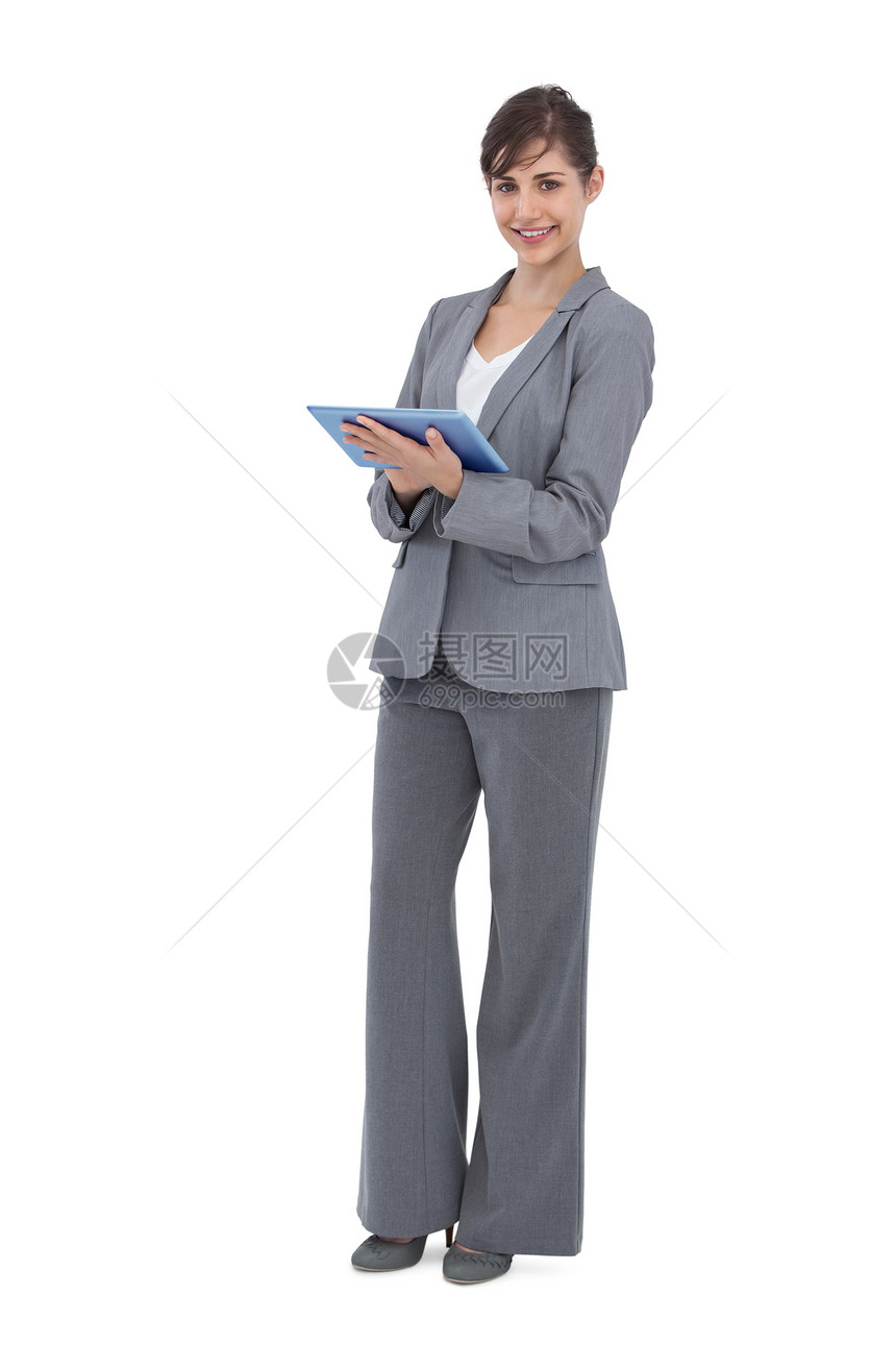 使用平板电脑打笑女商务人士图片
