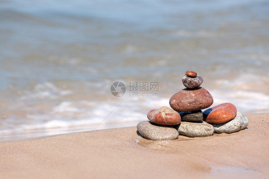 石头的堆积团体太阳建筑晴天旅行温泉蓝色海滩场景海洋图片