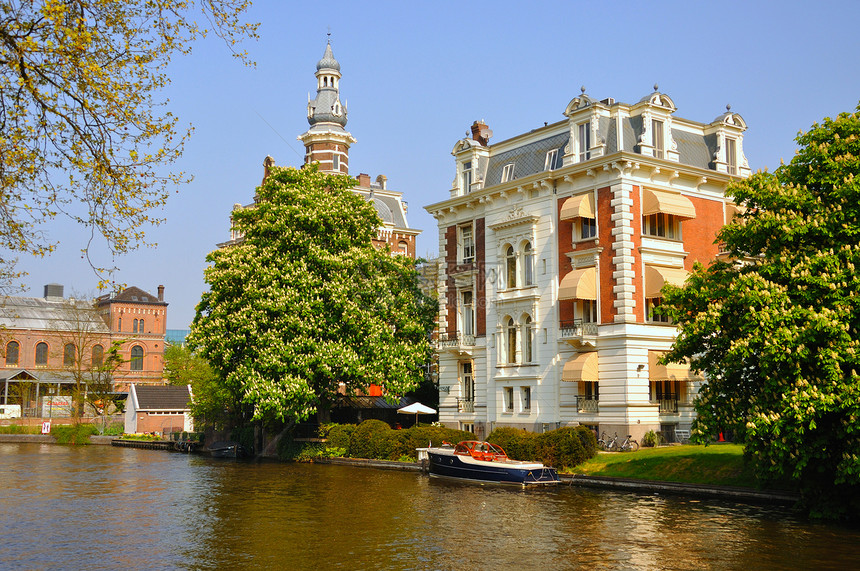 荷兰荷兰荷兰阿姆斯特丹有船只的美丽河流旅行天空建筑学餐厅旅游历史船屋运河支撑假期图片