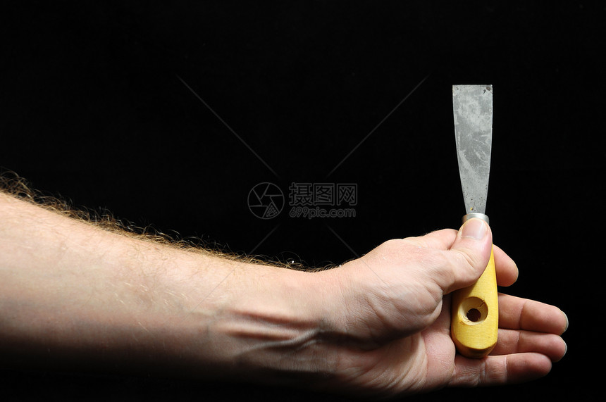 一个斯帕图拉和一只手乐器金属扳手工人工作工艺维修锤子图片