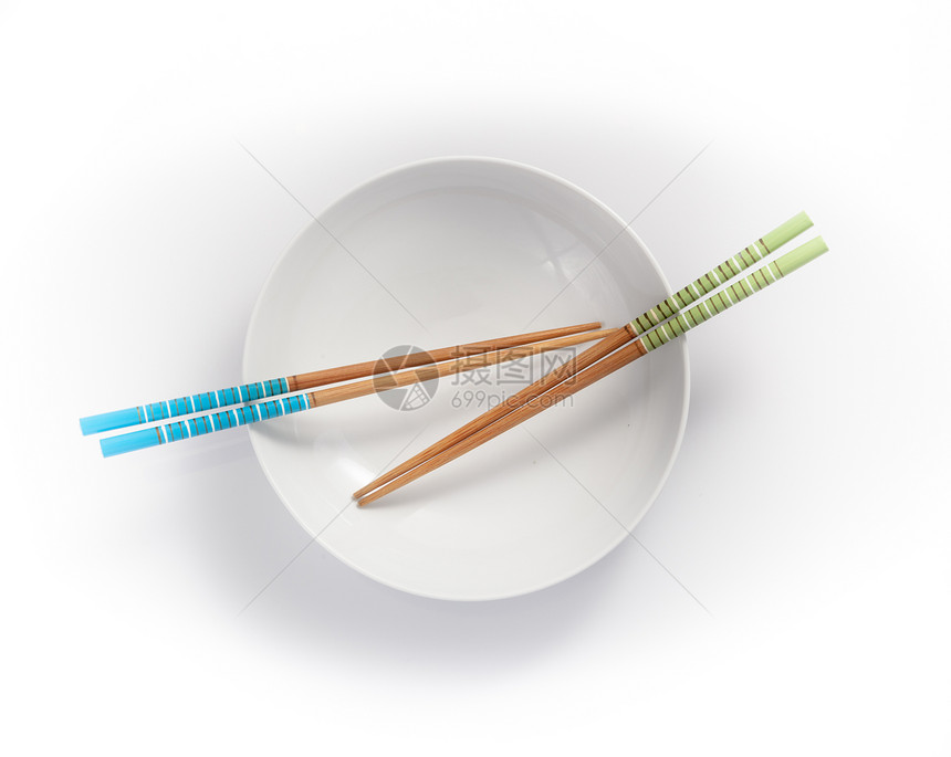 空碗中的筷子 在白色背景上被孤立餐具绿色图片