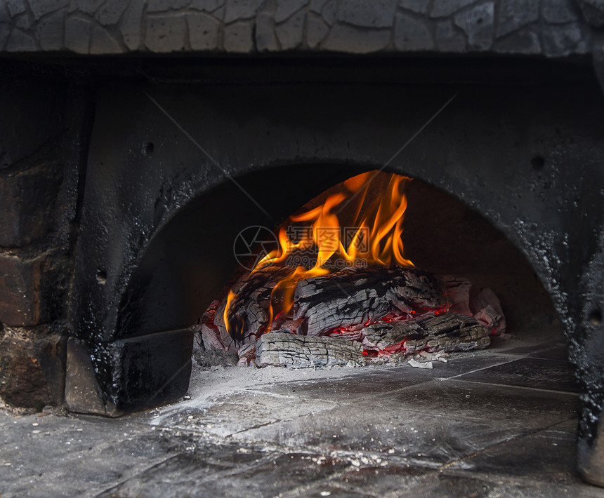 披萨烤炉烤箱烹饪餐厅柴火火焰燃料烘烤骨灰加热木头图片