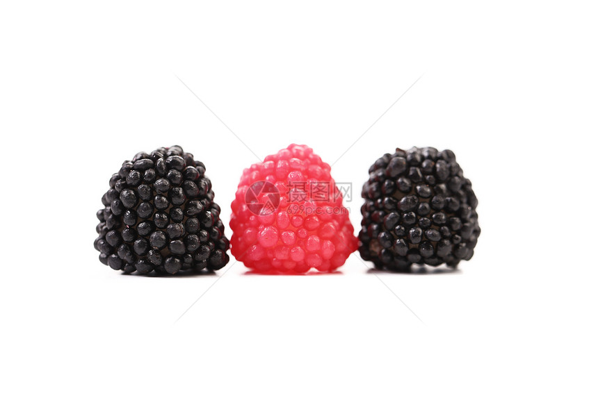 三个双彩色球黑色活力宏观红色条纹果汁绿色糖果垃圾食物图片