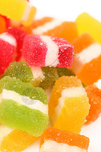 不同水果类糖果的背景 笑声橙子白色甜食黄色食物宏观红色绿色背景图片