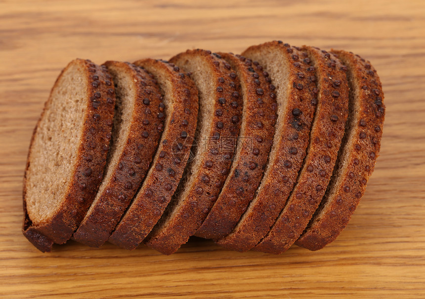 棕色面包和卷心菜木板谷物芝麻烹饪香菜麦芽食物美食粮食小麦图片