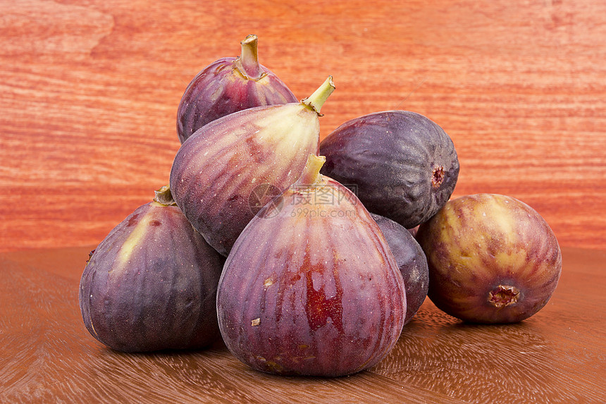 图果水果木头种子绿色紫色热带棕色红色市场宏观图片