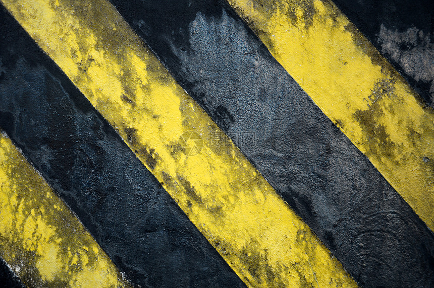 墙上的旧黑黄条纹建造团队风险场景杯子警卫街道交通障碍工作图片