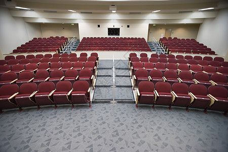 一所大学空空的讲学厅礼堂建筑学红色座位报告背景图片