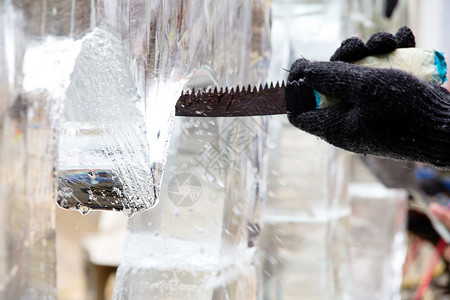 手冰冰雕刻艺术家艺术雕塑雕塑家工具工作工艺天气链锯创造力背景