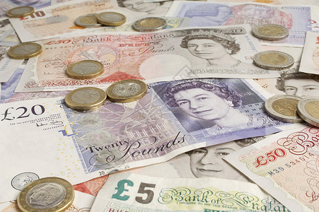 英镑硬币英国纸面货币和硬币全框架背景