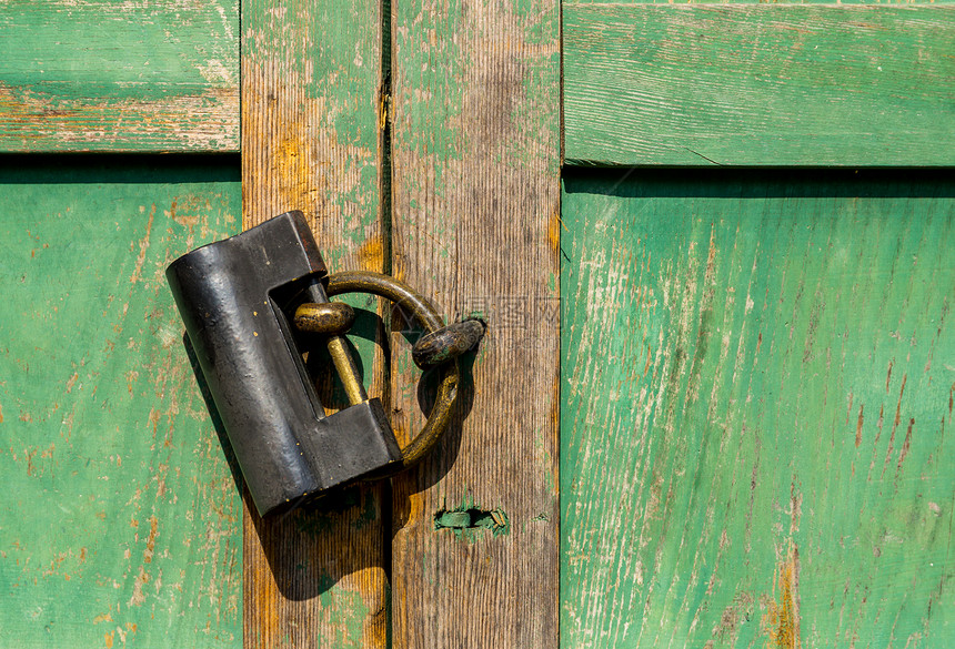 门锁绿色圆圈戒指金属门把手建筑学入口木头古董乡村图片