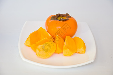 Persimmon 双环西蒙橙子维生素饮食食物白色营养热带水果市场柿子背景图片
