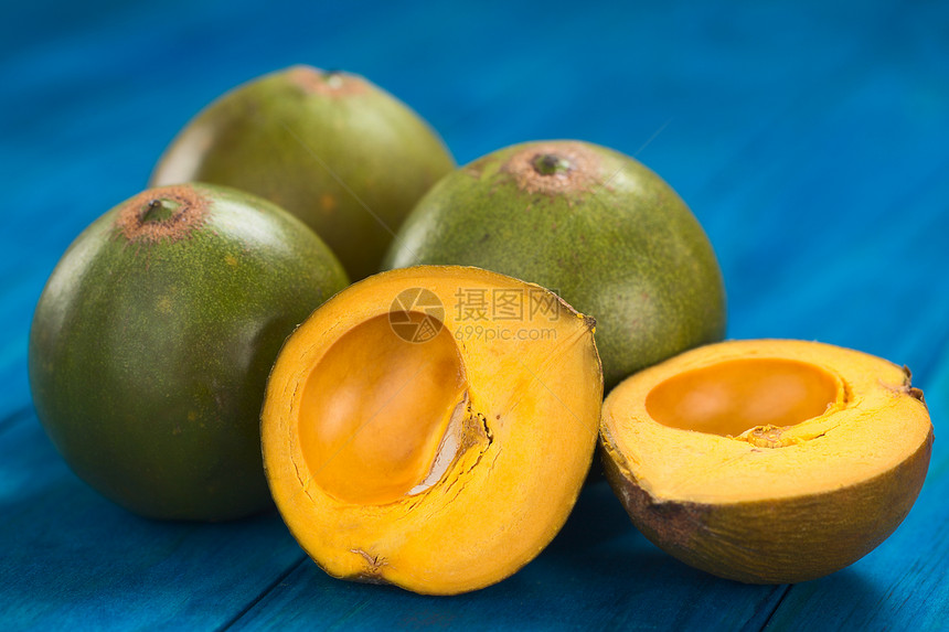 秘鲁水果叫Lucuma营养食物黄色蓝色亚热带橙子水平图片