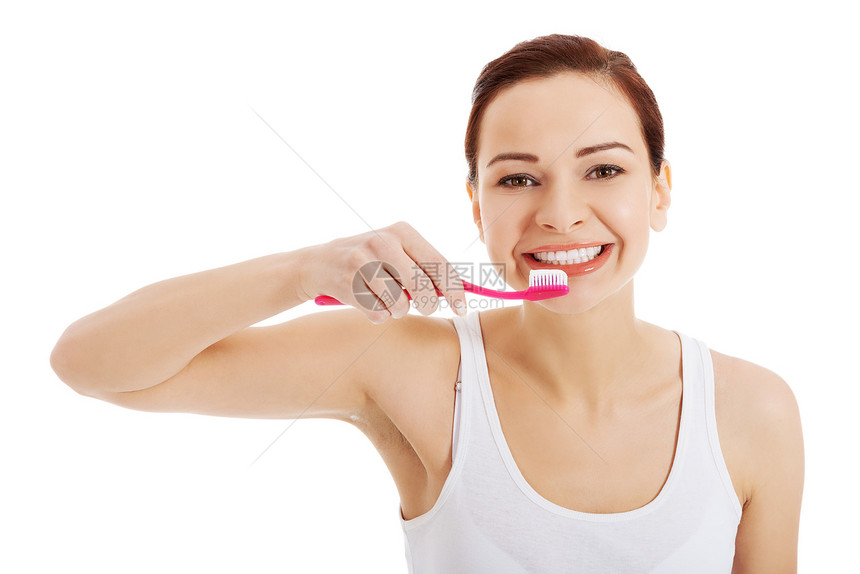 白顶的漂亮女人在刷牙成人治疗口服牙膏卫生微笑情绪浴室牙齿牙科图片