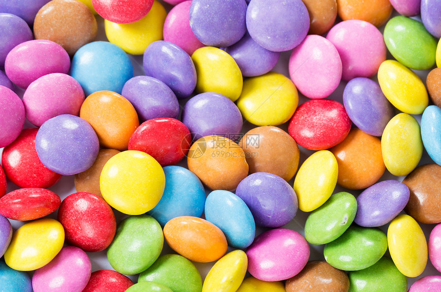 色彩多彩的糖果小吃宏观紫色绿色食物红色甜点粉色团体白色图片