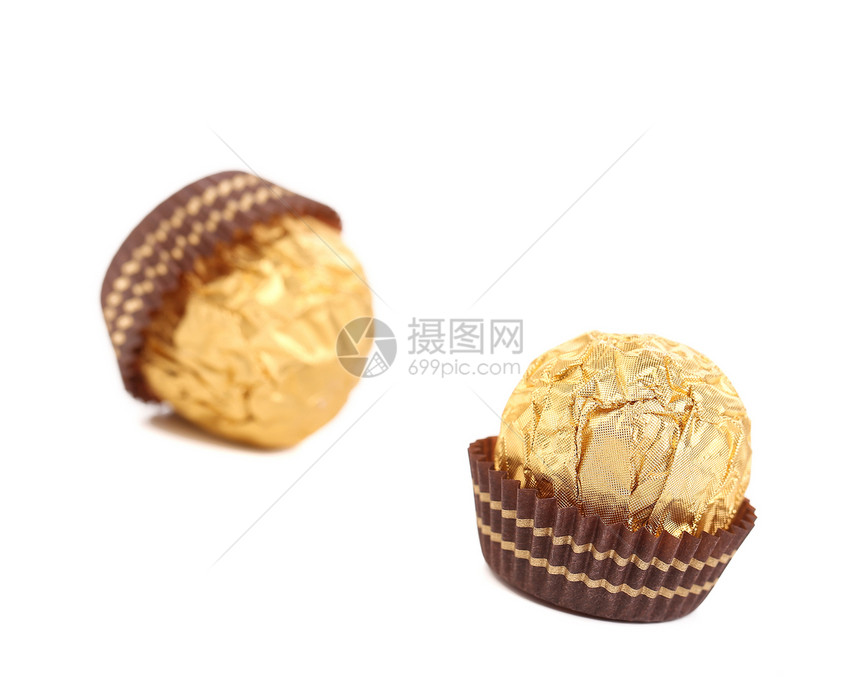 巧克力金盆子贴近了糕点白色飞碟食物松露糖果甜点饼干图片