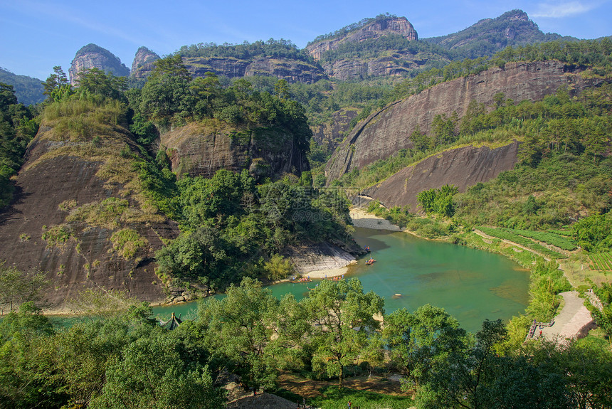 中国福建省武伊山峡谷 中国环境阳光晴天风景太阳溪流石头山沟木头林地图片